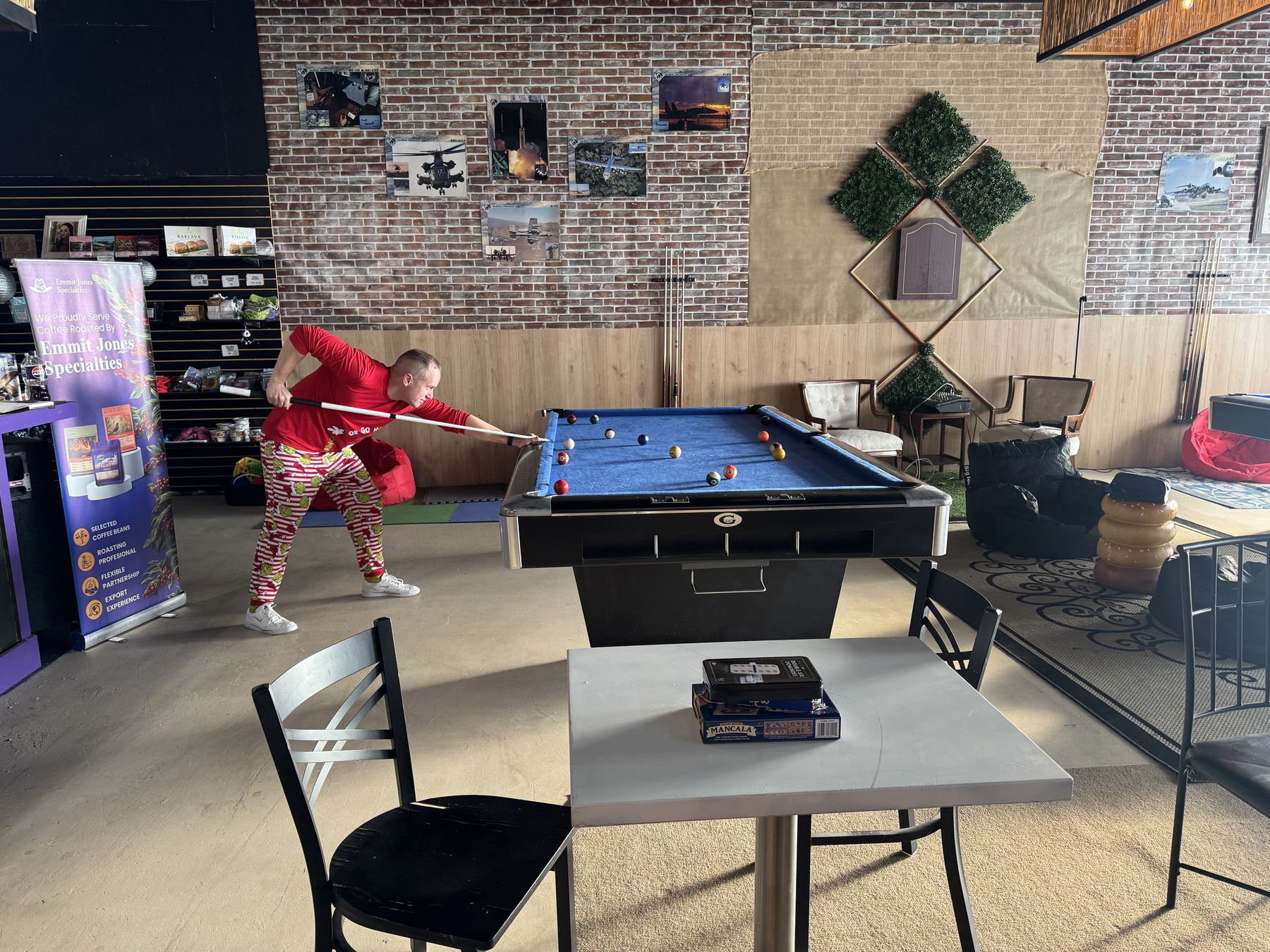 Pool tables and seating inside Jamila Coffee